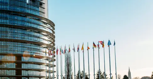Curved building with many countries flags